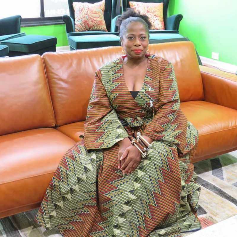 Naomi Davis sitting on a couch